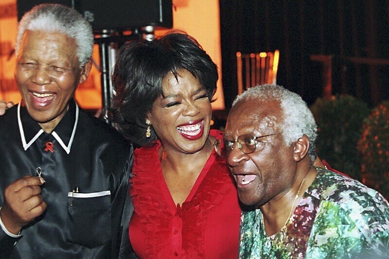 Bishop tutu with ophrah winfrey and nelson mandela