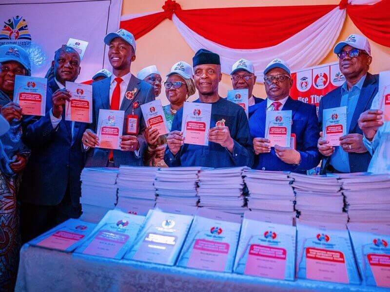 *  Vice President, Prof. Yemi Osinbajo (m) presenting the EFCC Club Manual at Model Senior Secondary School, Maitama, Abuja.
