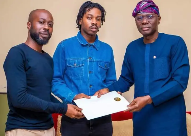 Mr Babajide Sanwolu, governor of Lagos State (right) condoling Onyeka Onwenu's children, Abraham Onwenu-Ogundenle  (left) and Tijani Onwenu-Ogundelene (middle) during the governor's visit on Sunday.