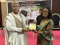*  Mrs Ebere Nwoji (left) receiving her award from the  Deputy Commissioner for Insurance (Technical), Mallam Abubakar Sabiu, at the just concluded retreat for Insurance Journalists which was organised by NAICOM at Uyo, Akwa Ibom State.