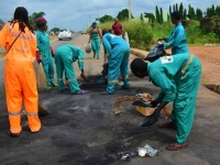 Cleaners cleaning up the aftermath of protests