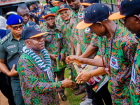 Governor Alex Otti (left) acknowledging greetings from ecstatic Abia workers on May Day.