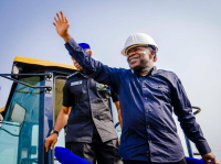 Governor Otti acknowledges cheers from the people after flagging off a section of the project at Akara in Isuikwuato.