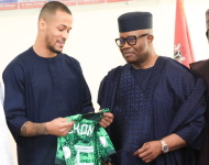 Senator Godswill Akpabio (right) with the Super Eagles of Nigeria Captain, William Troost-Ekong, when he received the players.